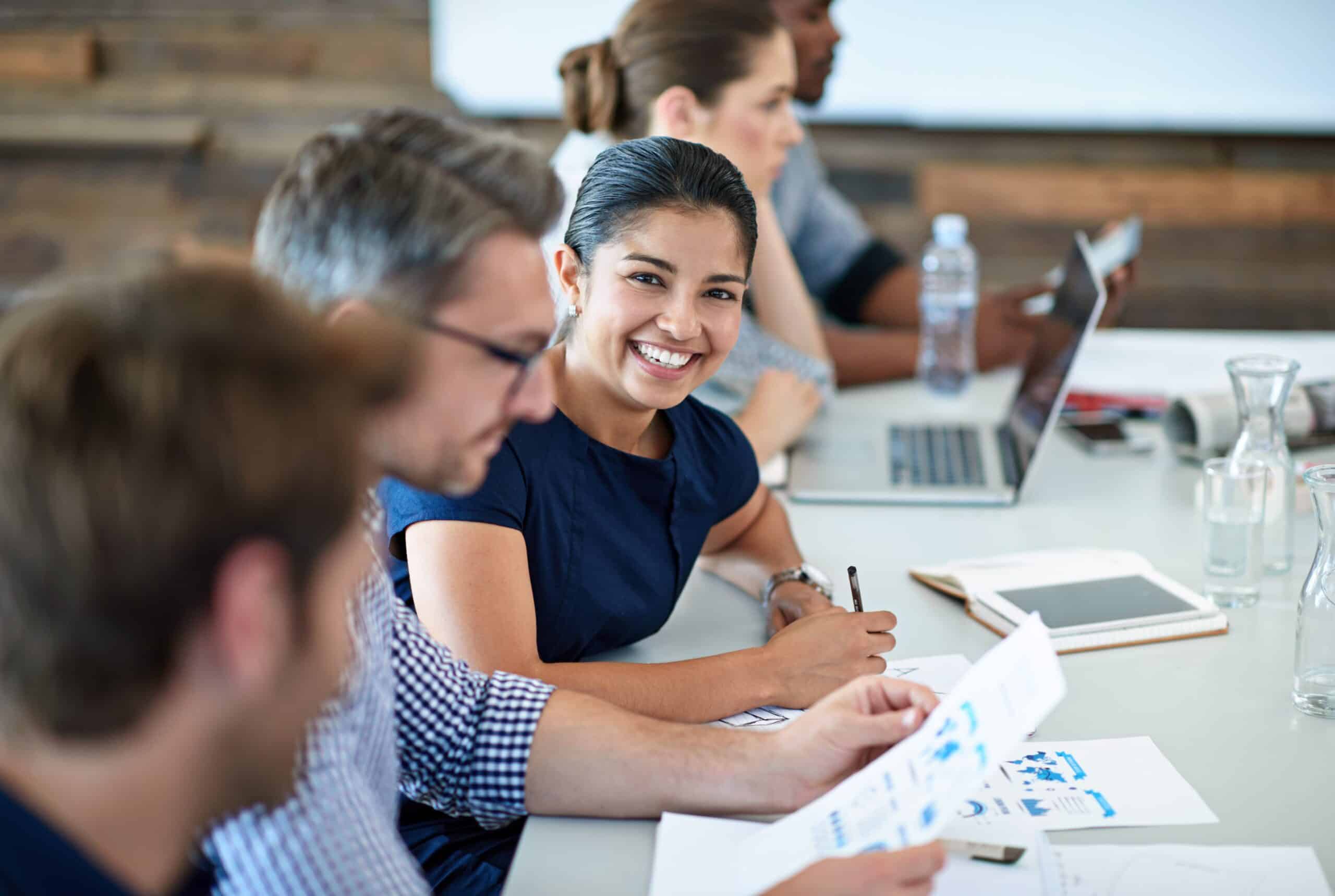 Business owner reviewing a plan with a relaxed smile, representing trust and confidence
